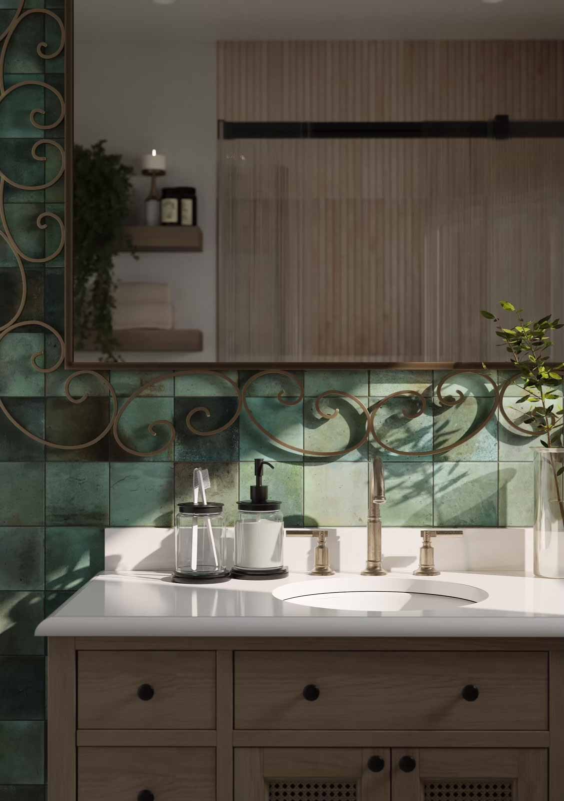 Vanity close-up with emerald zellige tile backsplash, brass fixtures, and scrollwork mirror