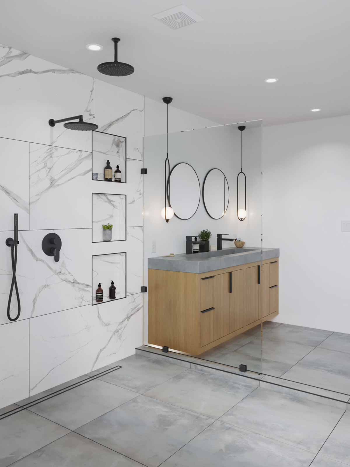 Double oval mirror vanity with concrete counter, oak cabinets, and marble shower