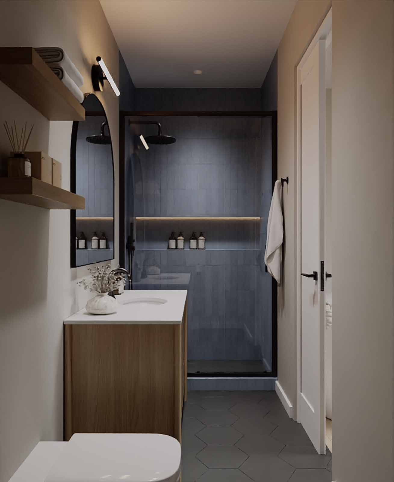Cozy bathroom with blue zellige tile shower, oak vanity, and hexagon floor tile
