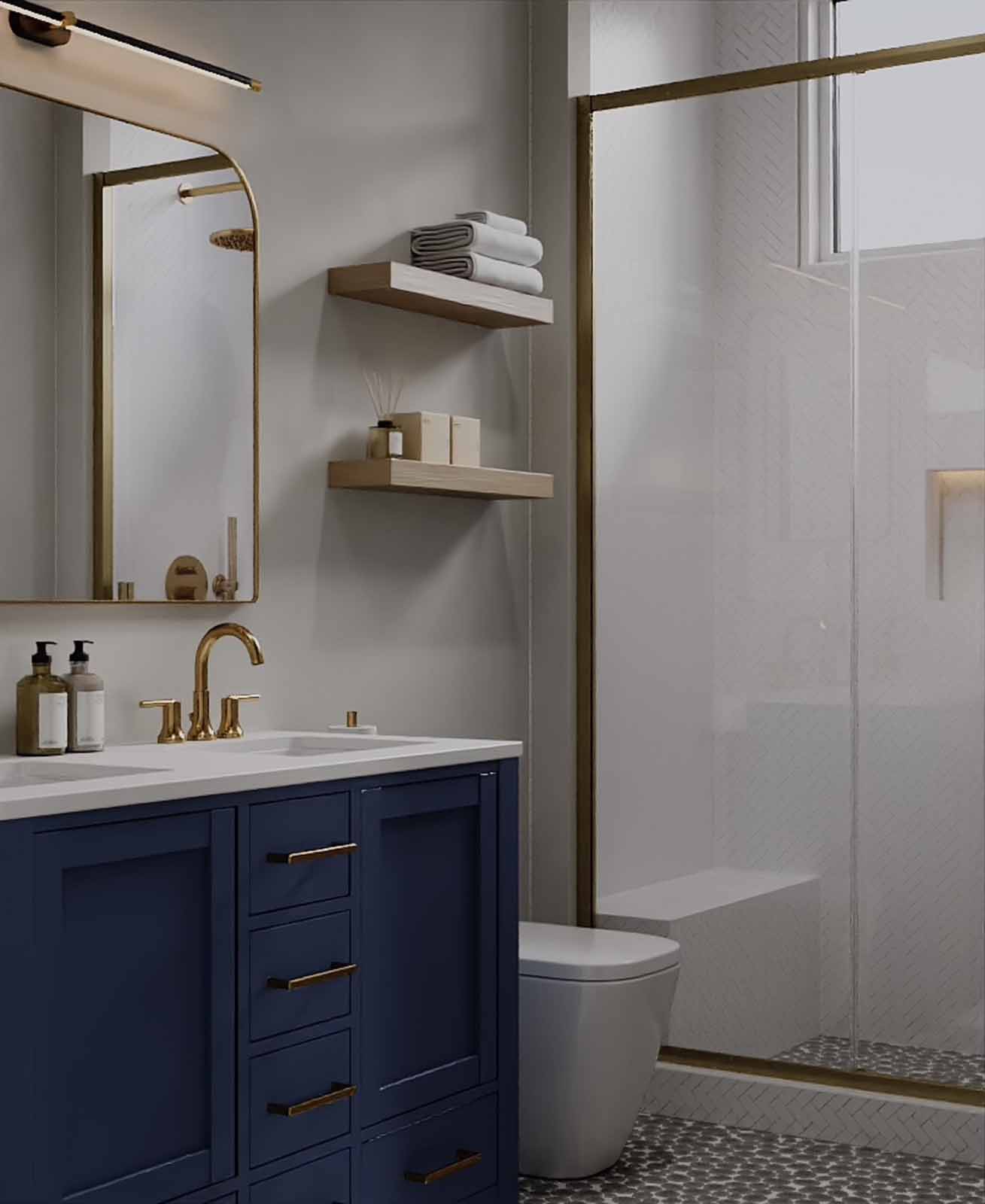 Navy blue vanity bathroom with gold fixtures, arched mirror, and herringbone shower tile
