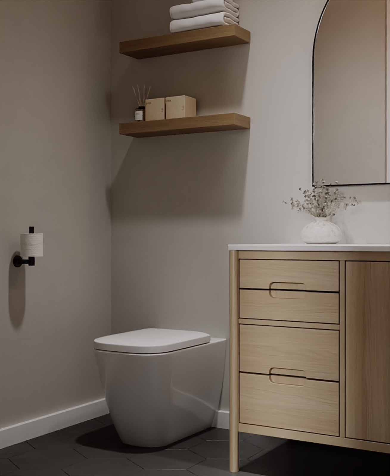Cozy powder room with oak vanity, floating shelves, and black hexagon floor tile