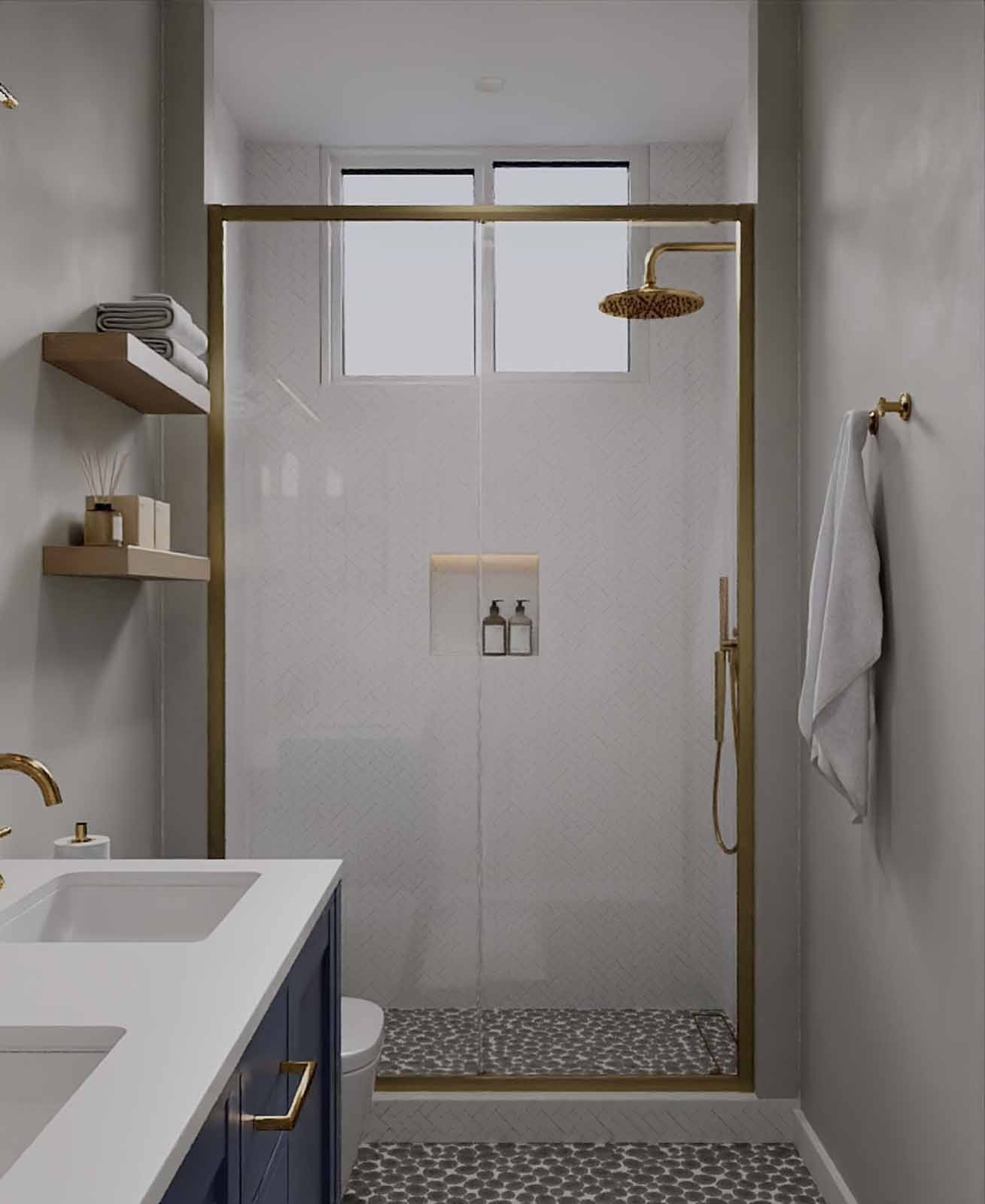 Navy vanity bathroom with gold-framed shower, pebble floor tile, and floating shelves