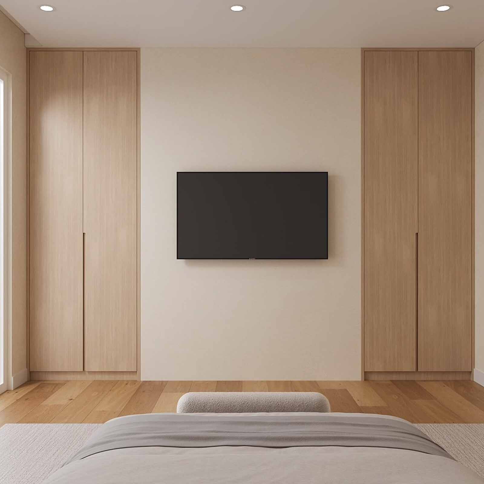 Serene master bedroom with oak wardrobes, wall-mounted TV, and boucle bench