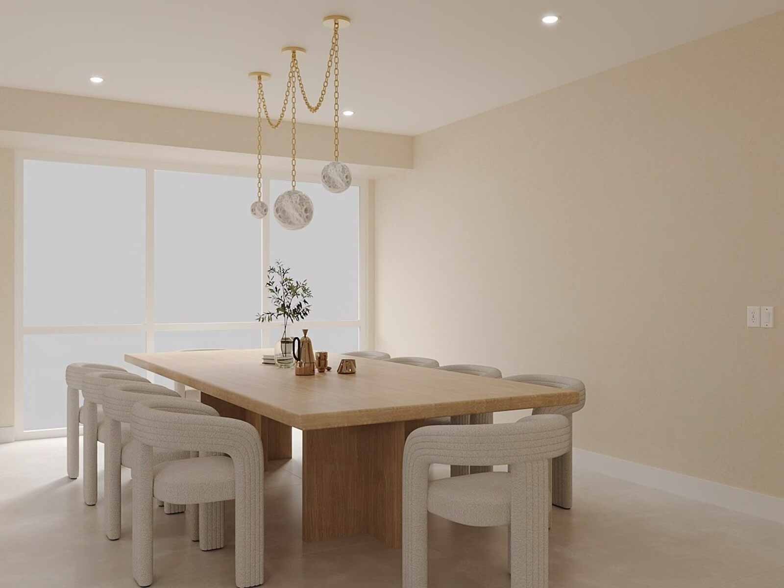 Elegant dining space with oak table, sculptural boucle chairs, and gold chain pendant lighting