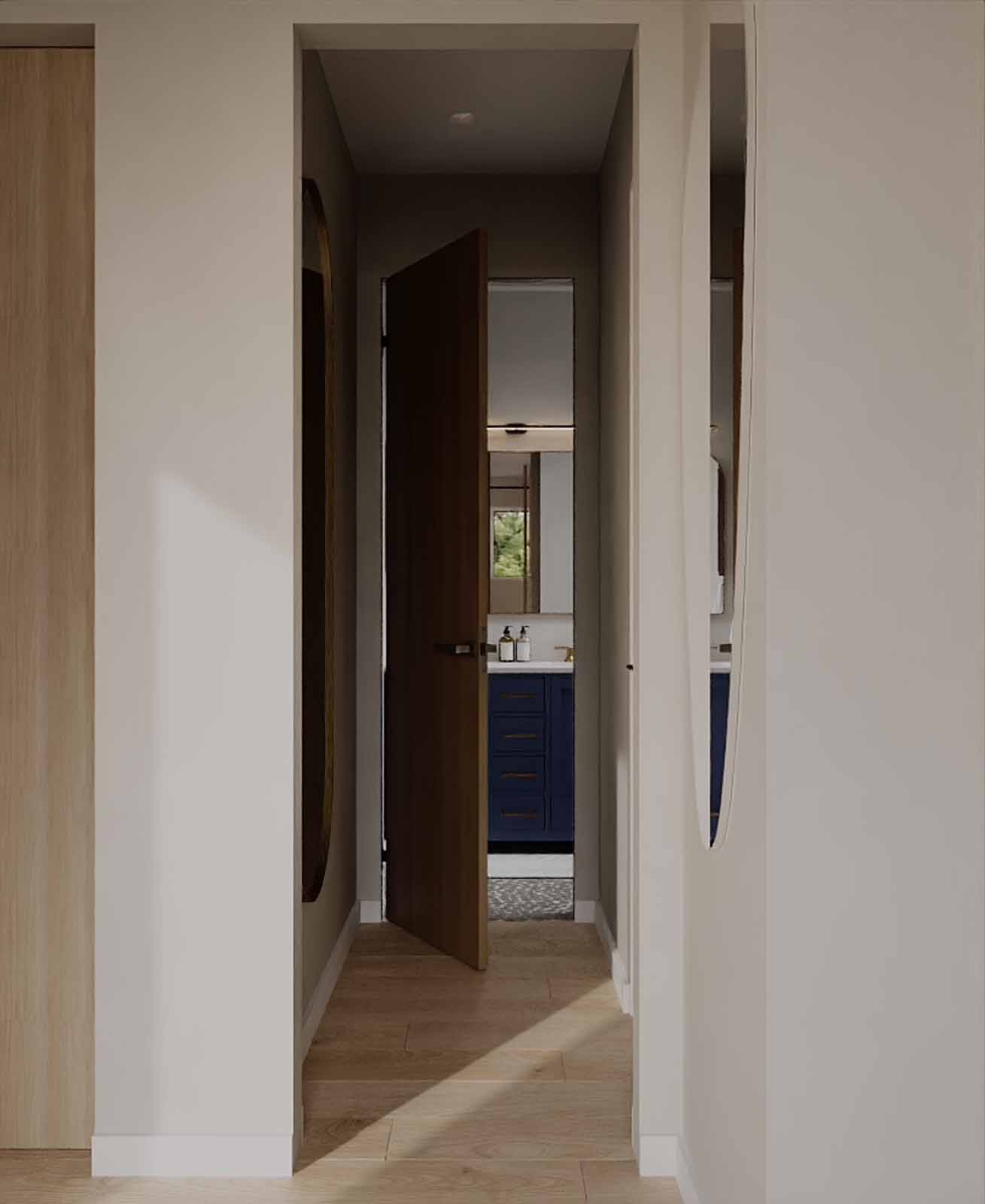 Sunlit hallway with walnut door, sculptural mirror alcoves, and view to blue vanity bathroom