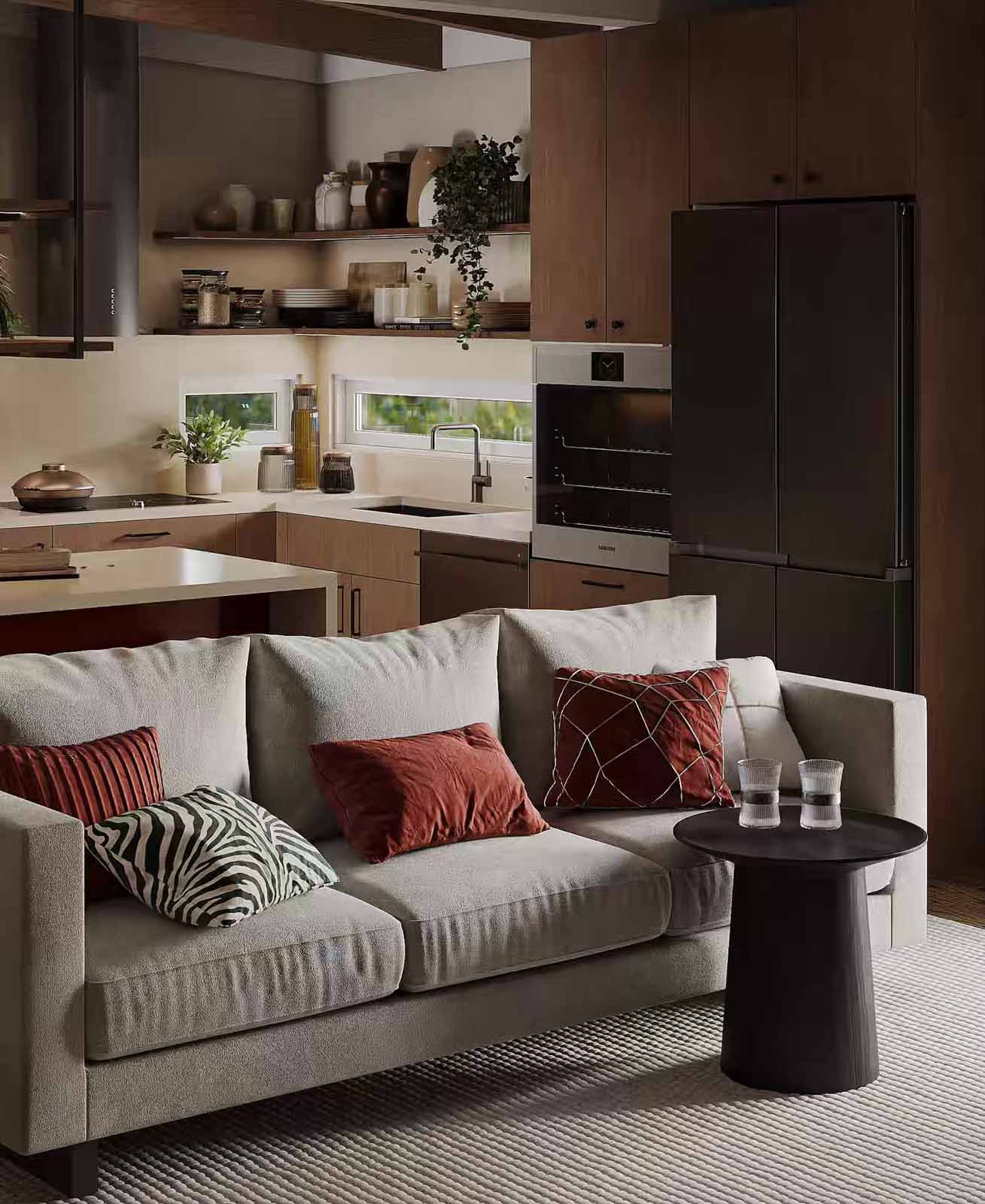Warm contemporary kitchen with walnut cabinets, cream sofa, and terracotta accent pillows