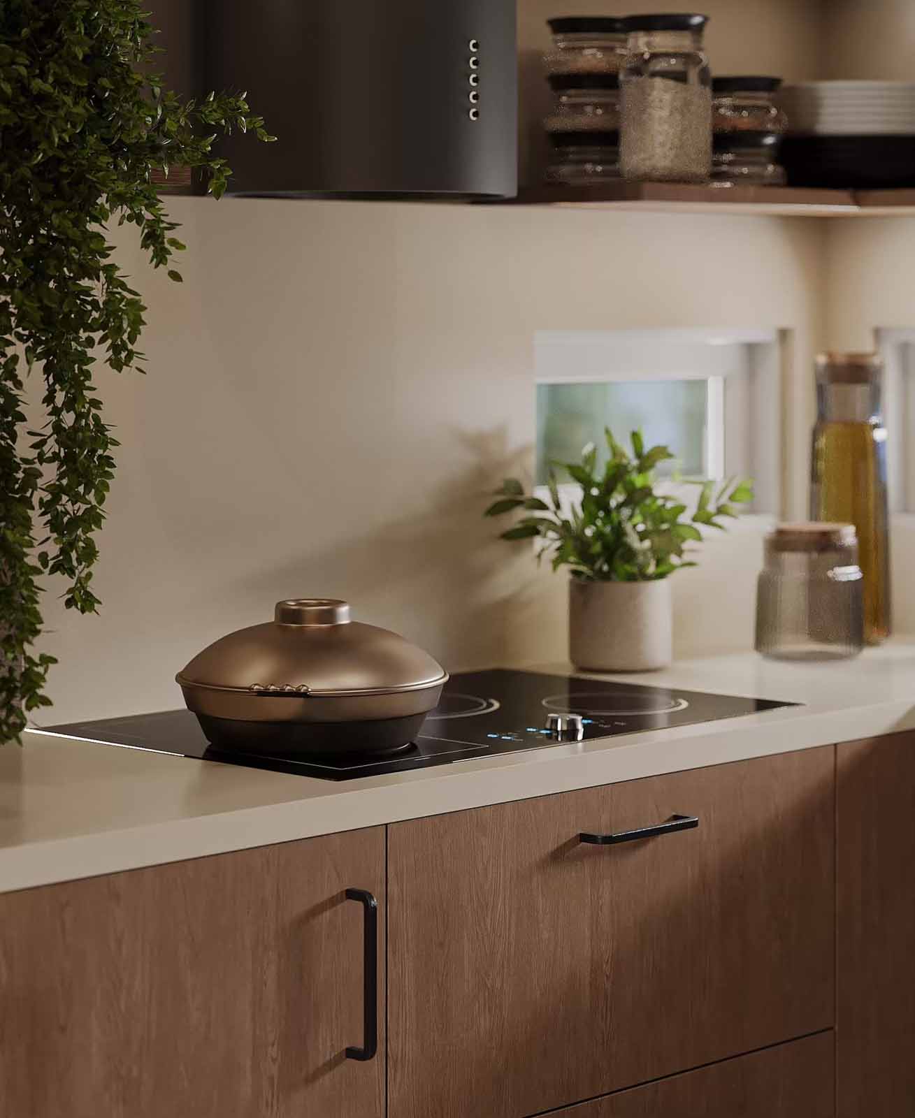 Kitchen cooktop detail with walnut cabinets, black range hood, and cascading greenery