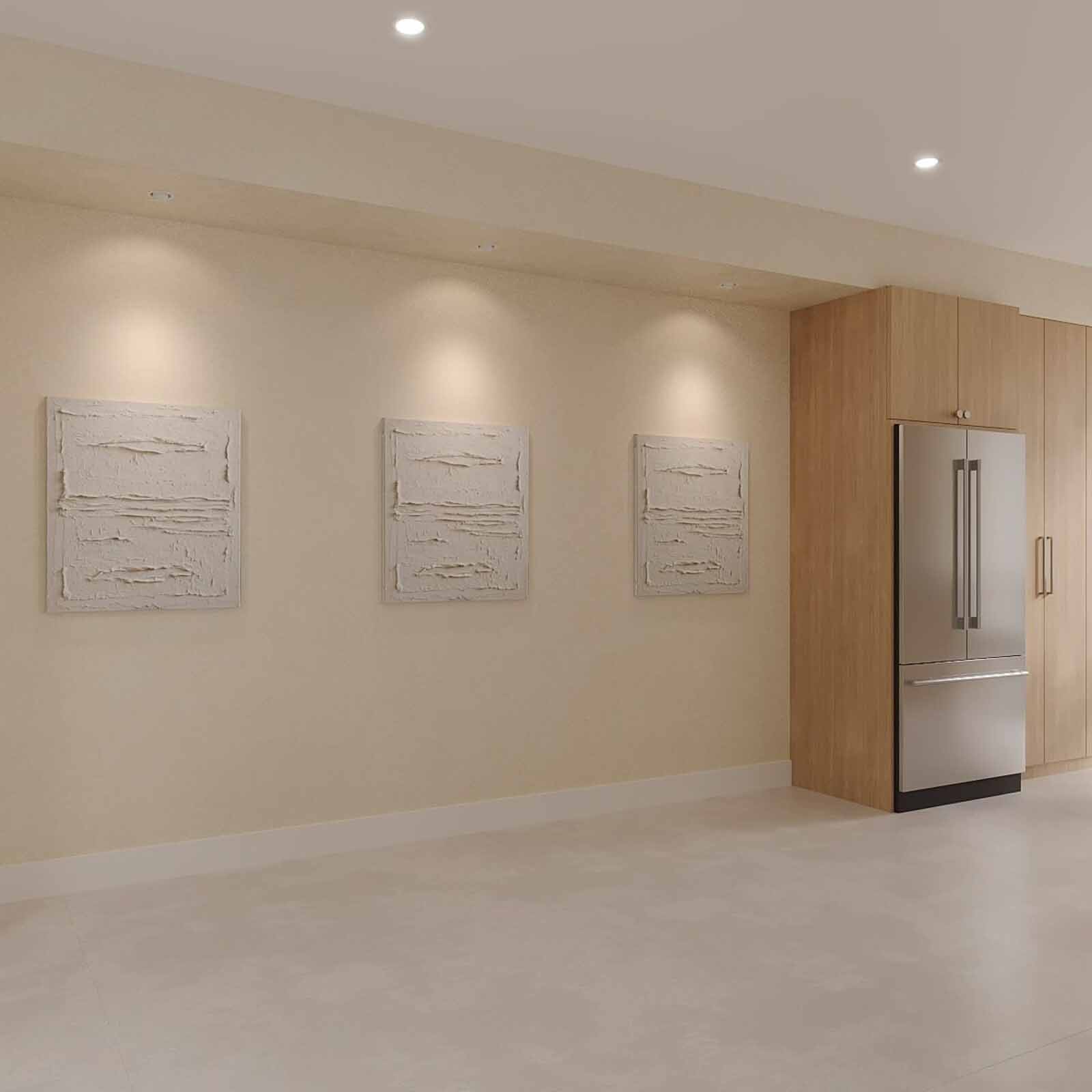 Open kitchen with oak cabinetry, textured art gallery, and integrated refrigerator