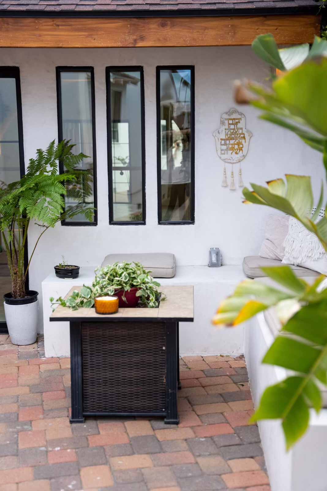 Sherman Oaks yoga studio ADU outdoor patio seating with plants and modern windows