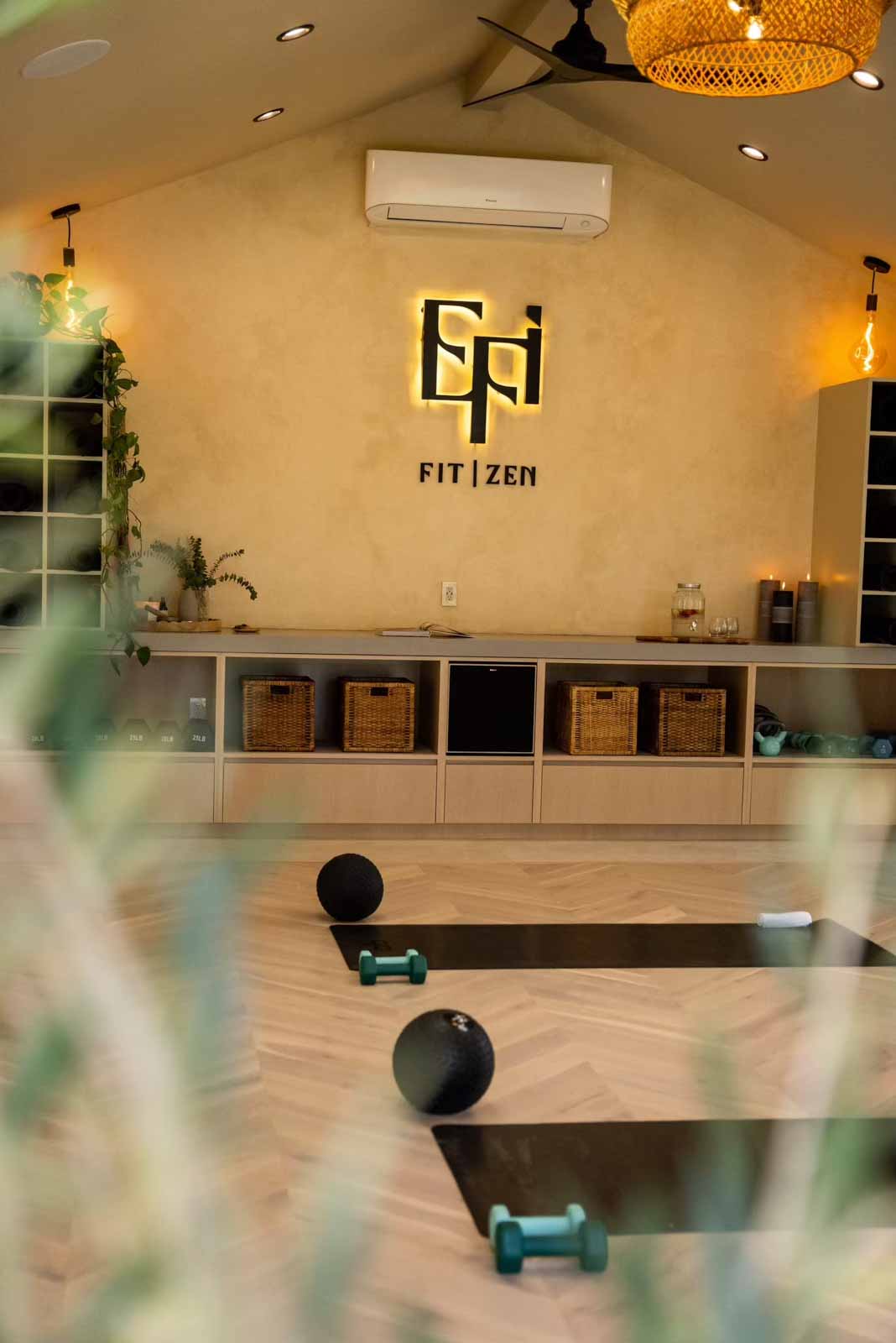 Artistic view of yoga studio interior through plant leaves