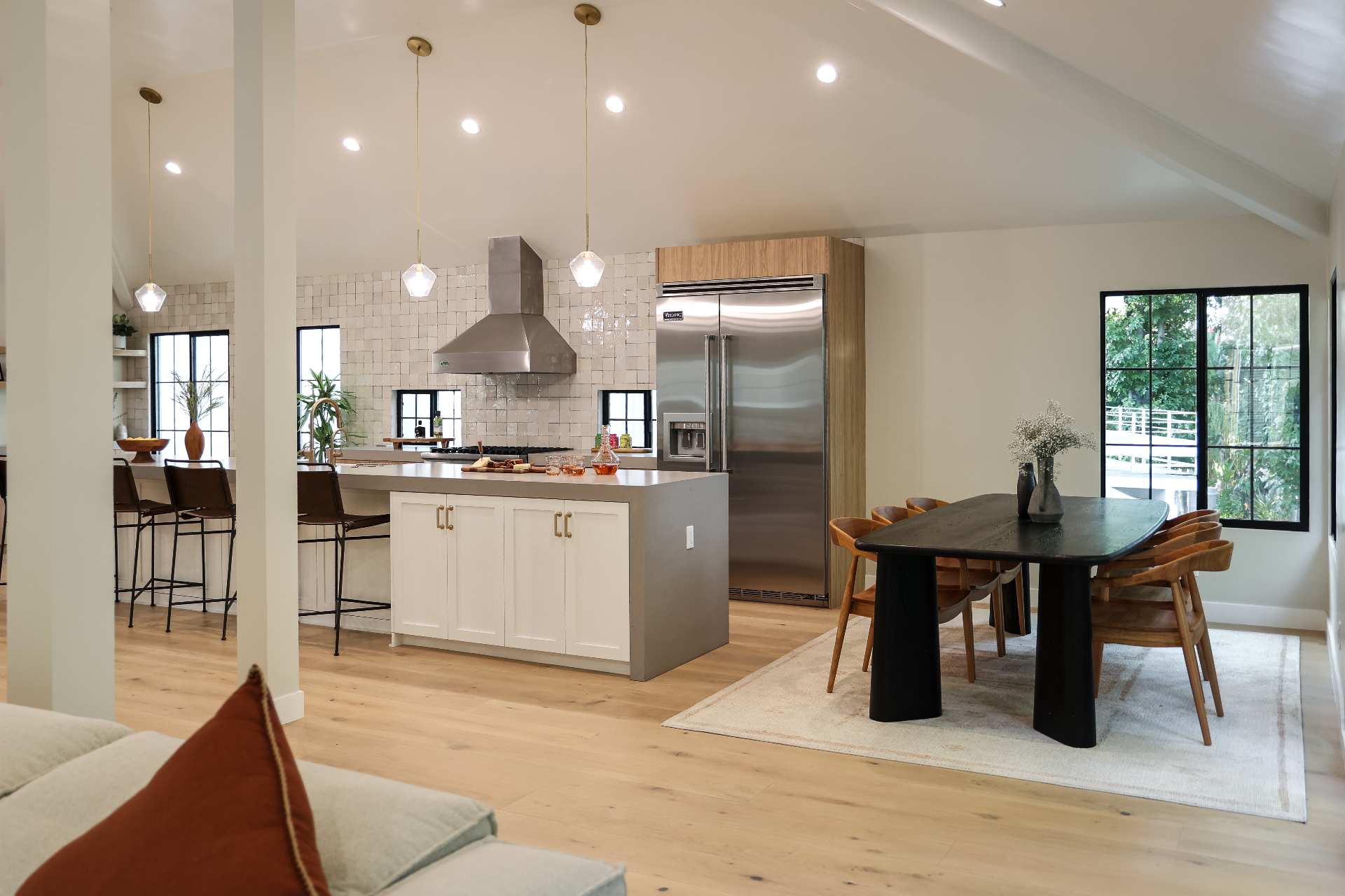 Open concept kitchen and dining space in Burbank with seamless flow, hardwood floors, and modern design elements