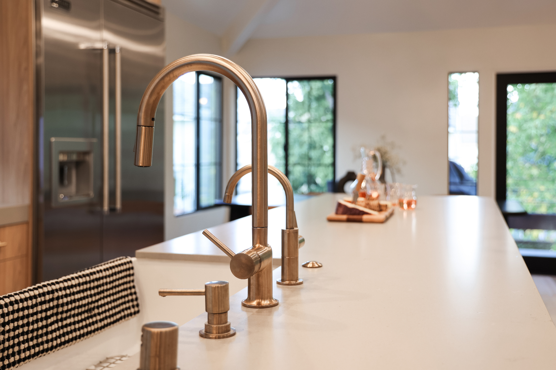 Premium modern kitchen faucet with pull-down sprayer and brushed nickel finish on granite countertop