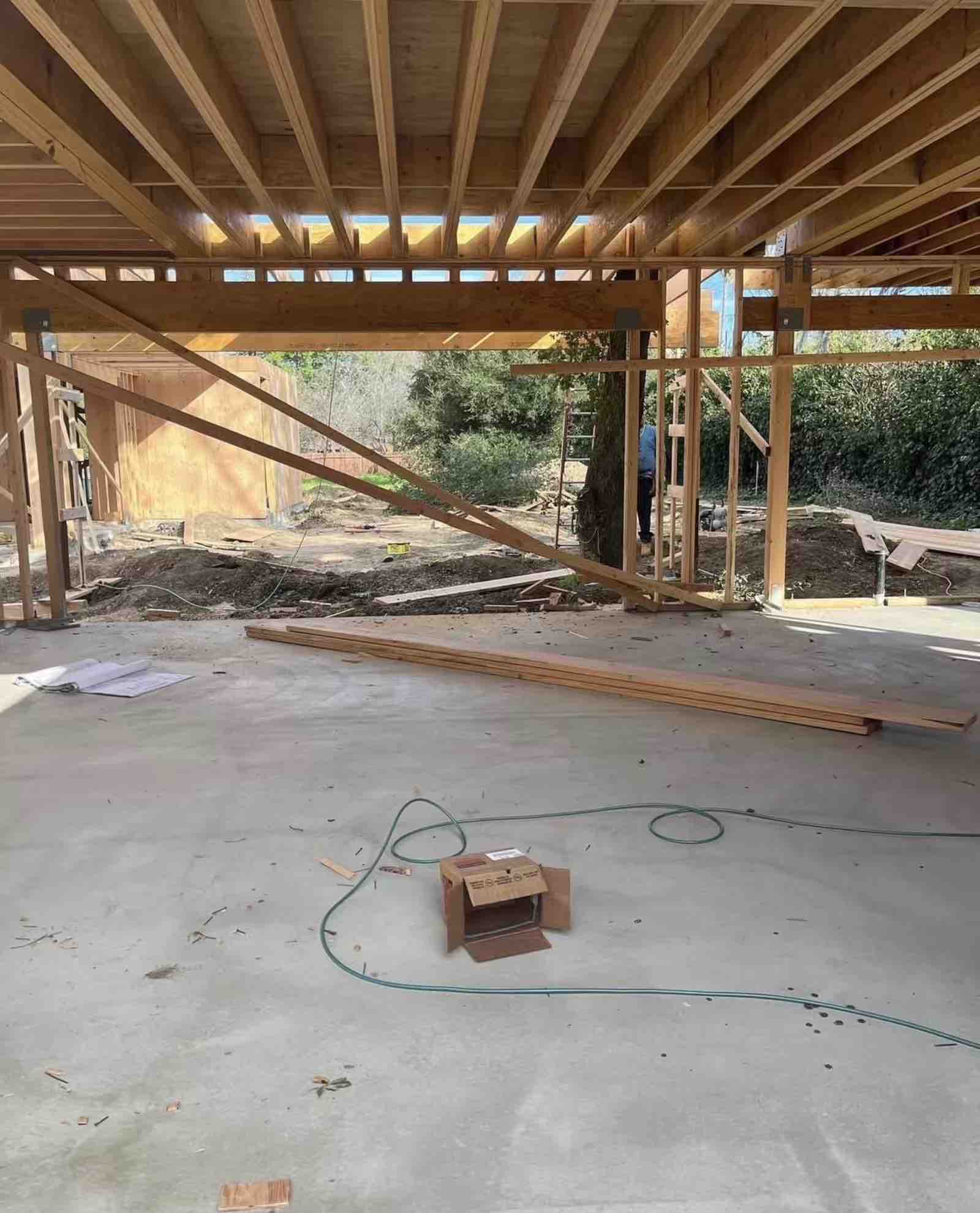 Sherman Oaks room addition floor framing with ceiling joists, steel beam, and concrete slab foundation