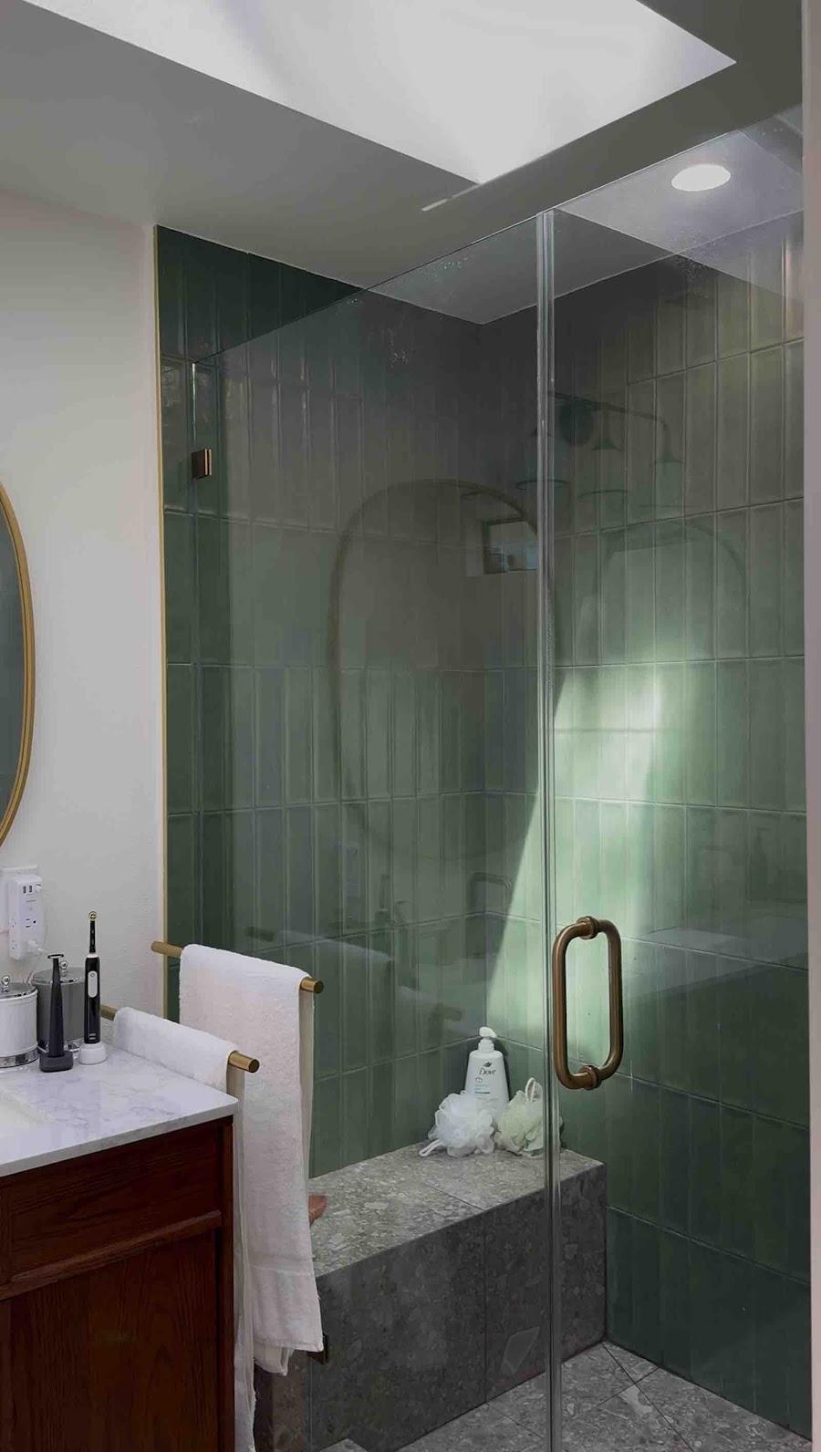 Agoura Hills luxury shower with green tile and brass hardware