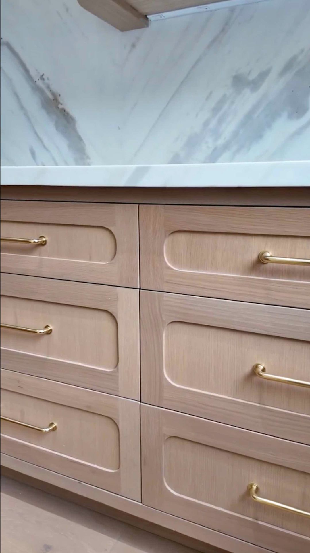 Brentwood kitchen custom white oak drawers with brass pulls