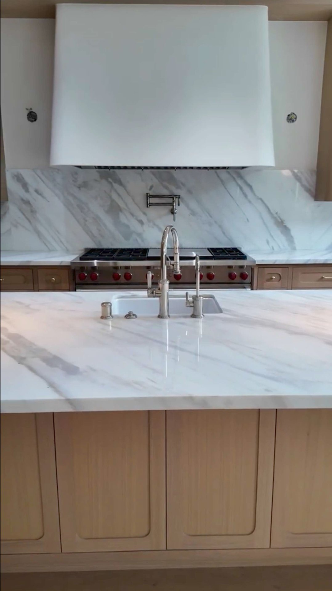 Brentwood kitchen marble island with prep sink and faucet
