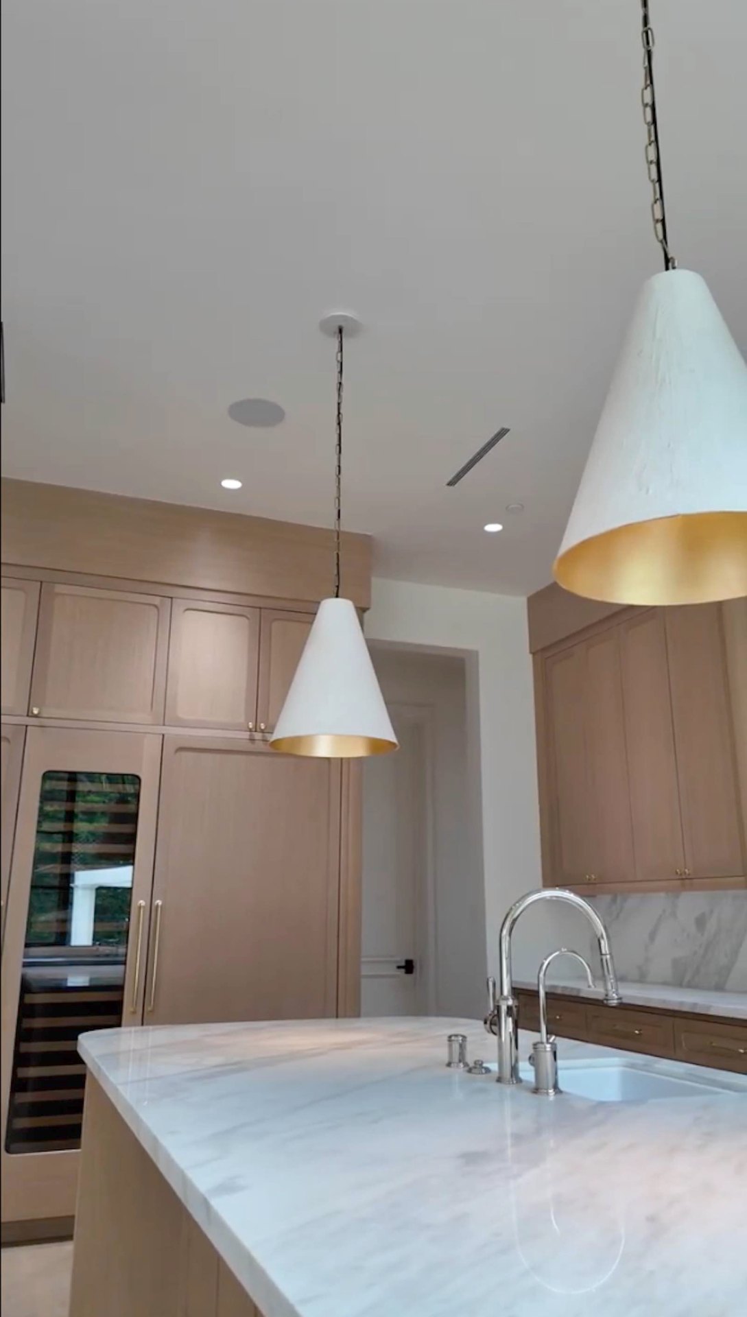 Brentwood kitchen dual cone pendants with gold interior