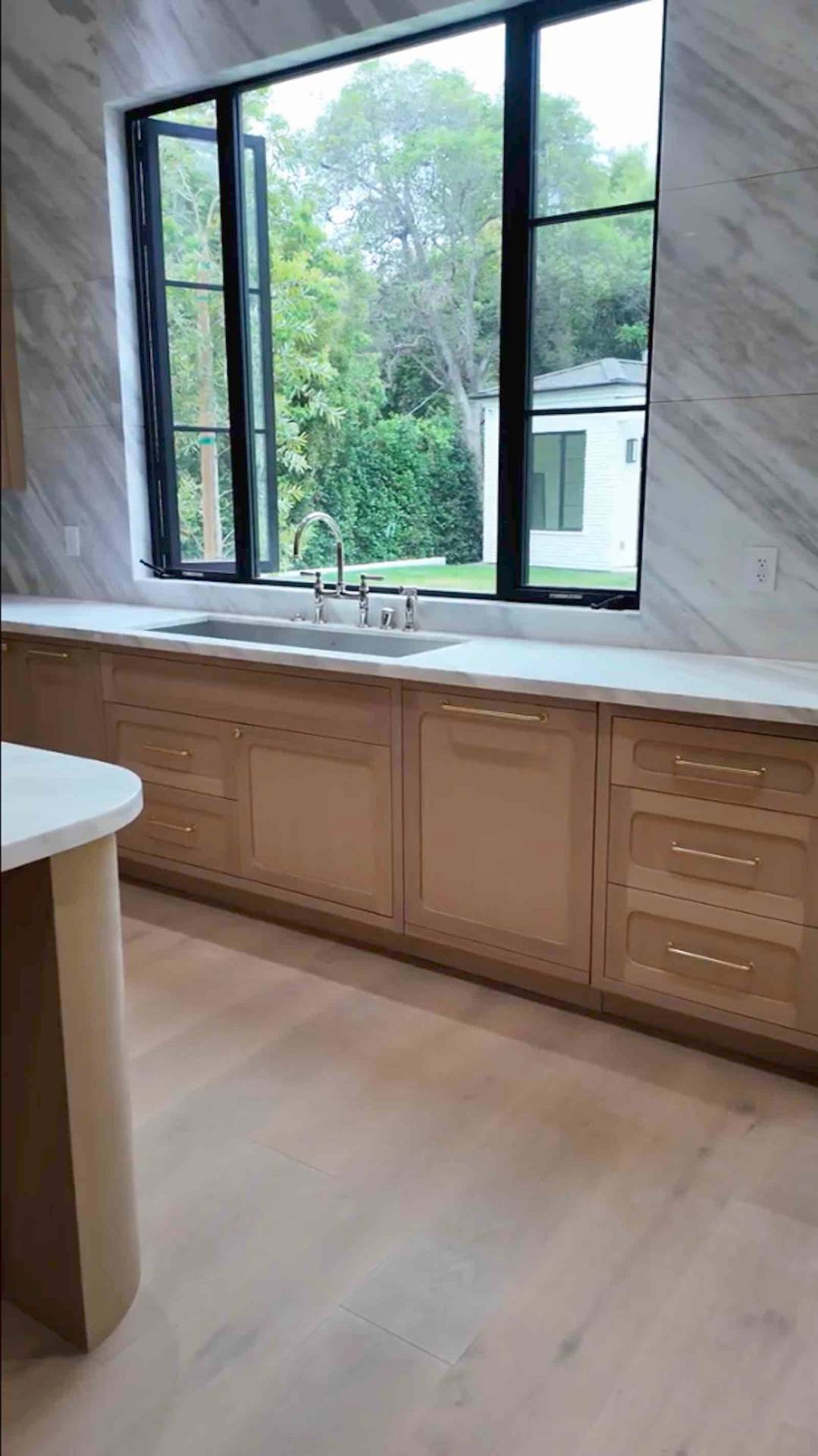 Brentwood kitchen sink area with black frame garden windows