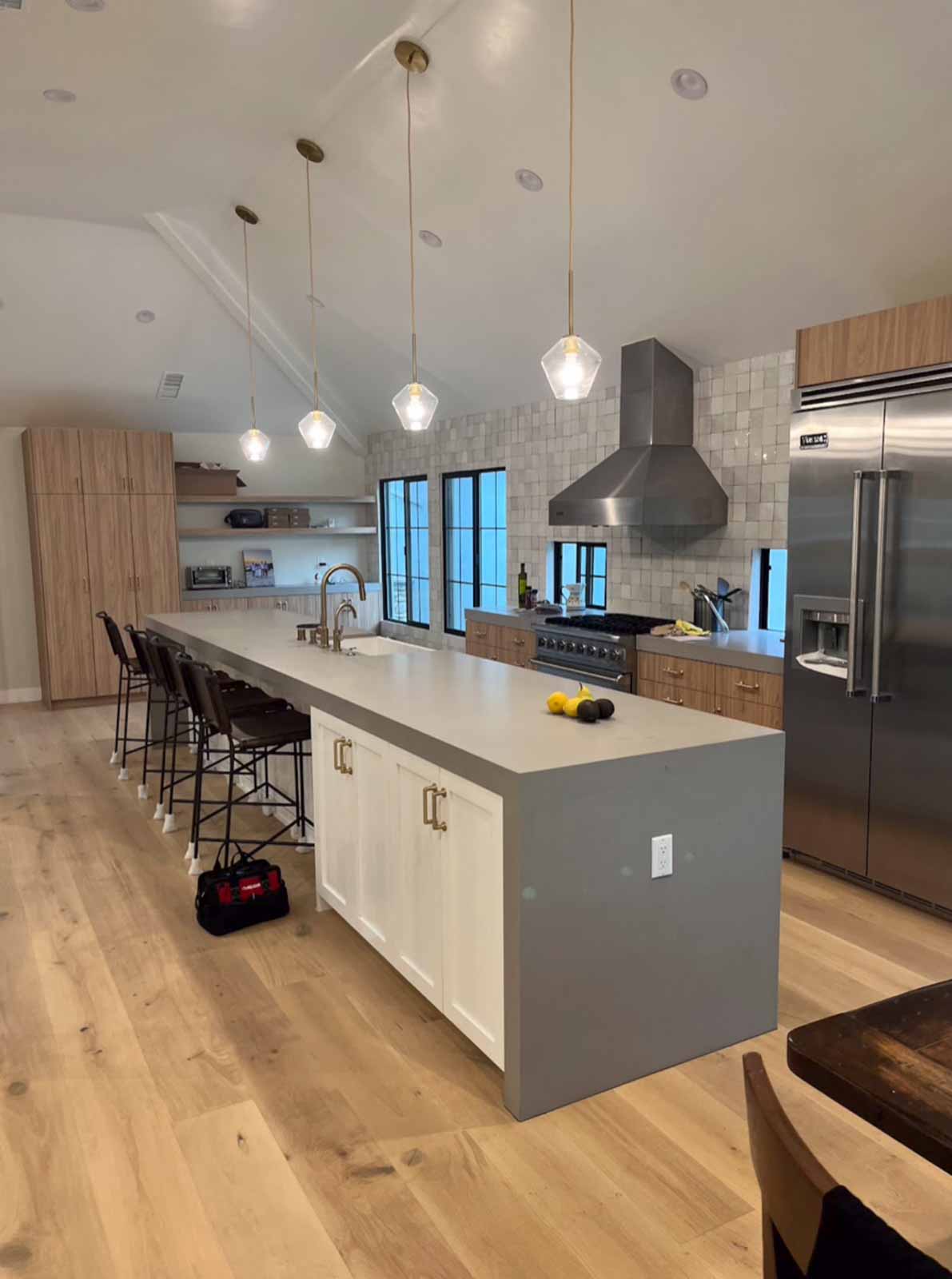 Long Beach kitchen island view with pendant lights