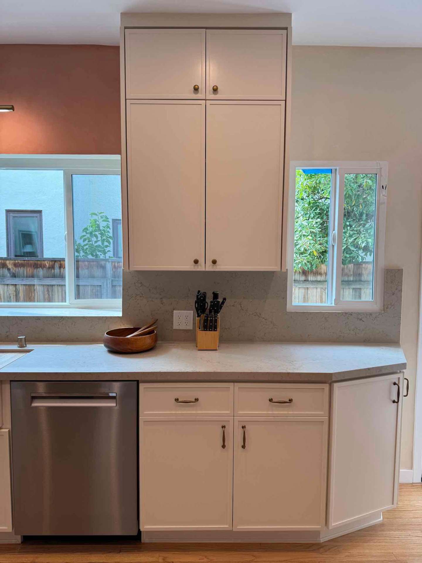 Rancho Park kitchen white cabinetry with quartz backsplash and natural light
