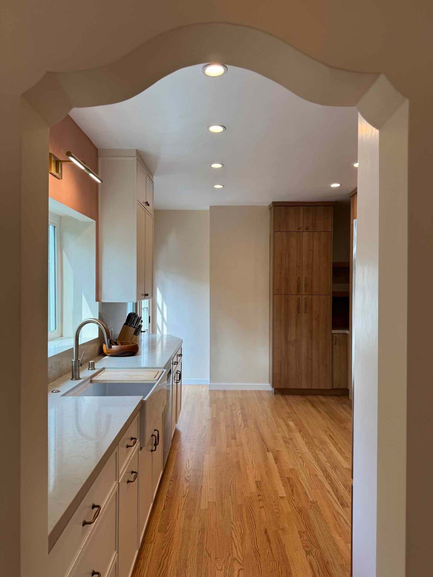 Rancho Park kitchen full view through Spanish-style archway