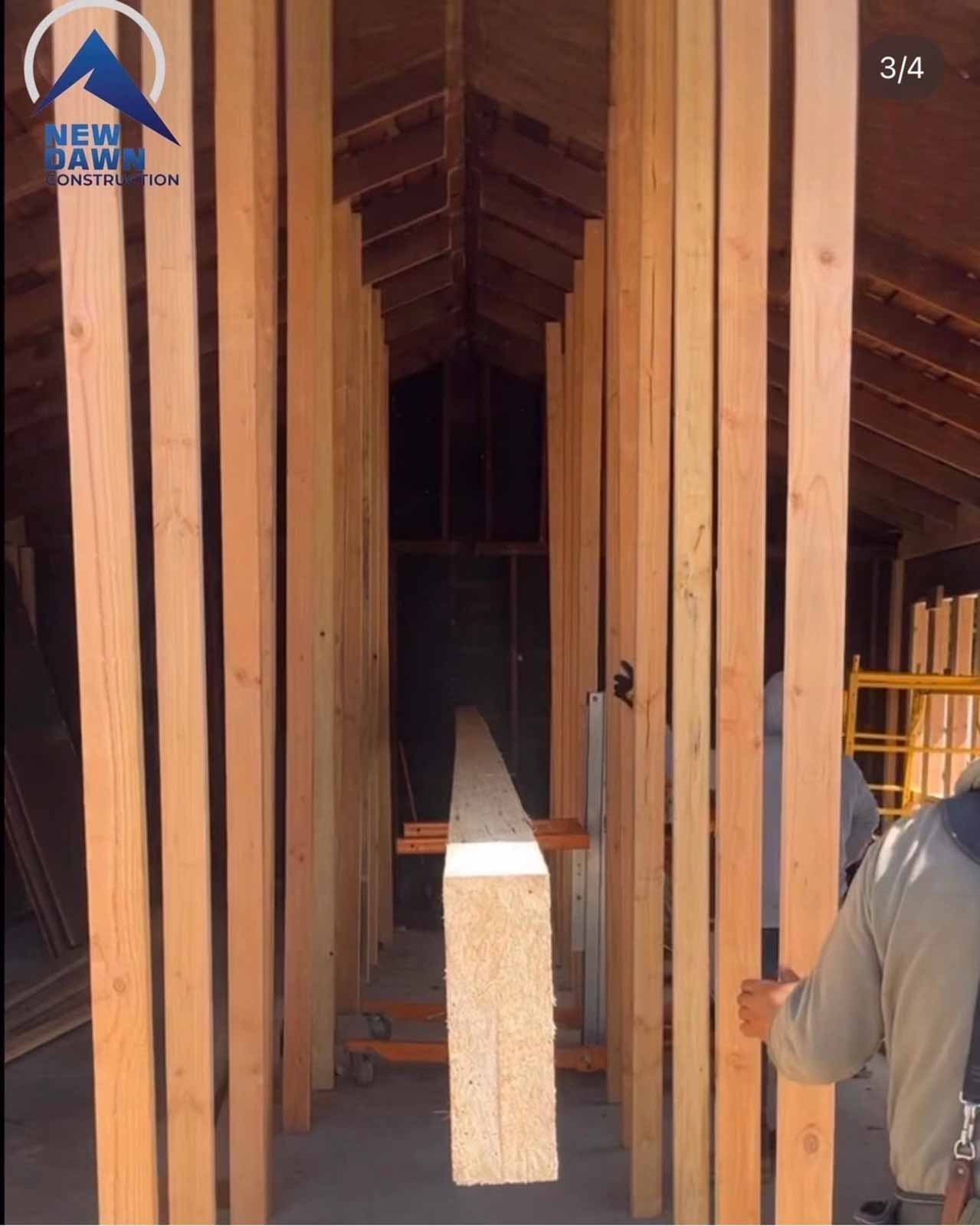 Vaulted ceiling framing interior room addition with exposed wood studs and hallway framing - professional construction