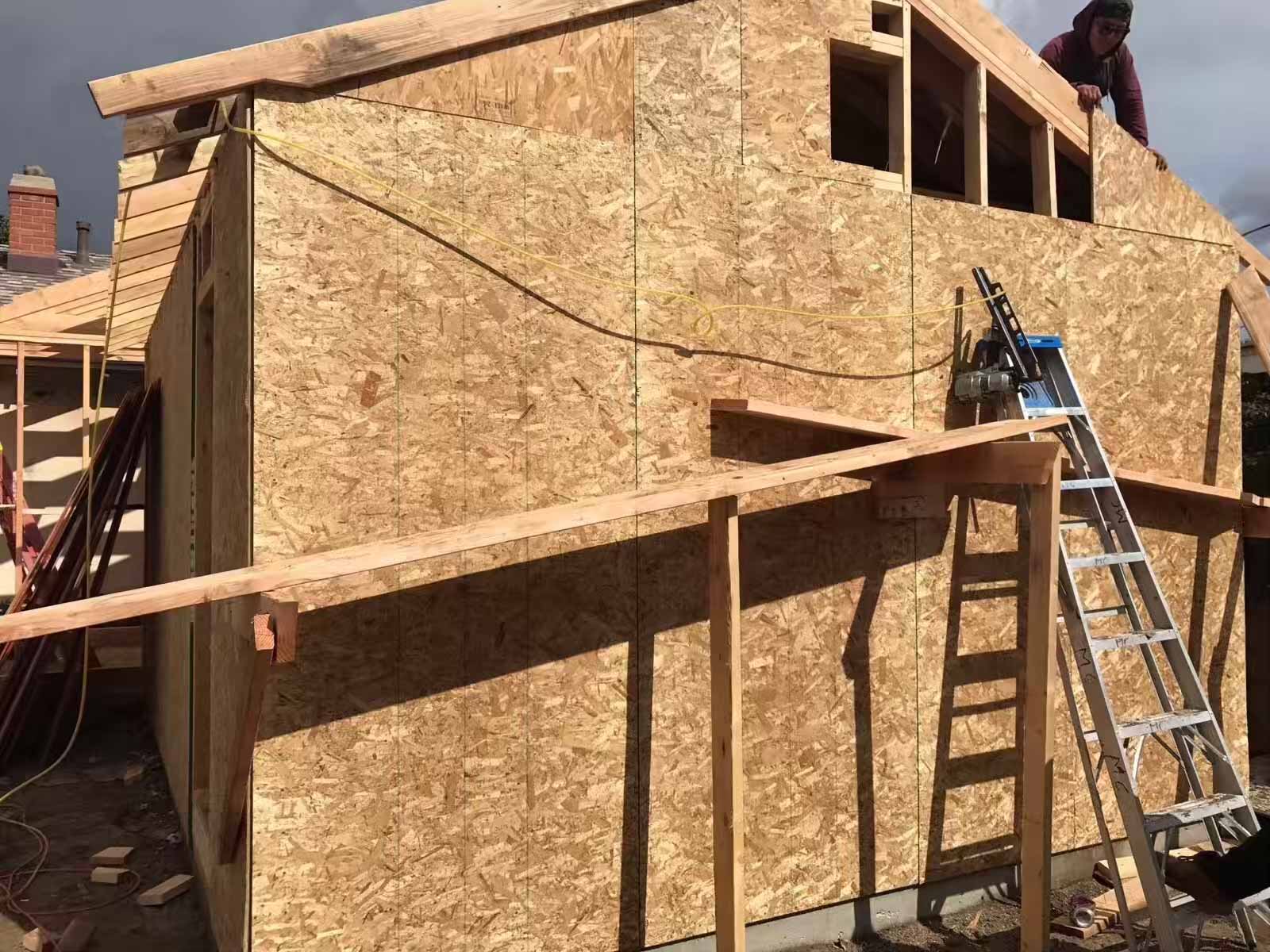 Second story room addition Sherman Oaks with OSB sheathing and window framing - home expansion contractor
